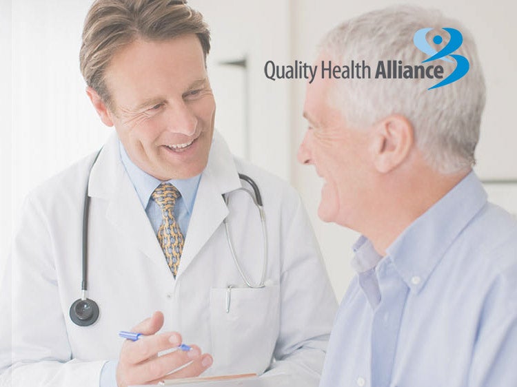 An older patient consulting with a doctor