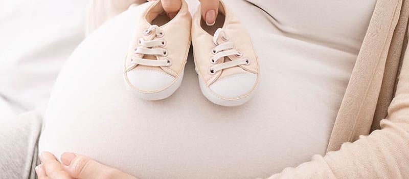 pregnant woman with booties