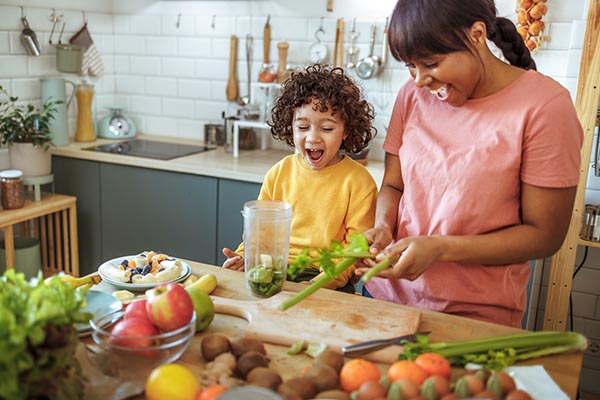 mom and son making dinner