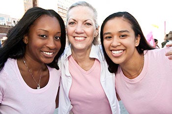 Three women smiling together