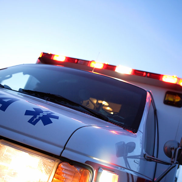 A dutch angle shot of a speeding ambulance