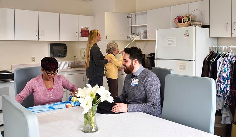 Faculty working together in the employee lounge